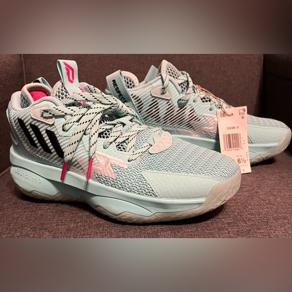 Adidas Unisex basketball shoes. Color: Energy Aqua/Core Black/Team Shock Pink.